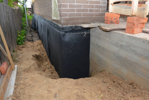 Happy homeowners after waterproofing job in Bradner